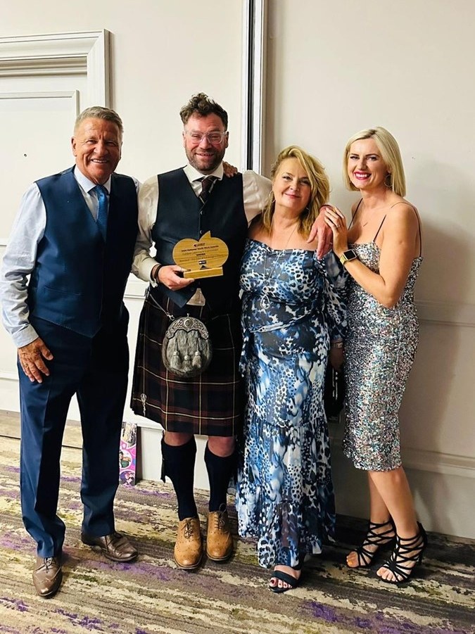Youth Link Award Winner Ross award winner with colleagues