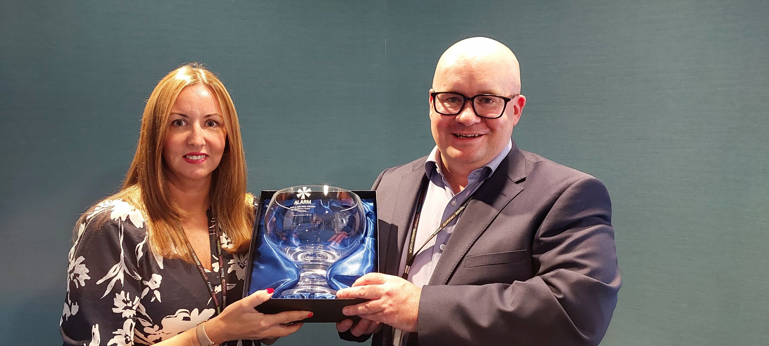ALARM Award Irvine 2025 (2) Alex and Donna holding the award