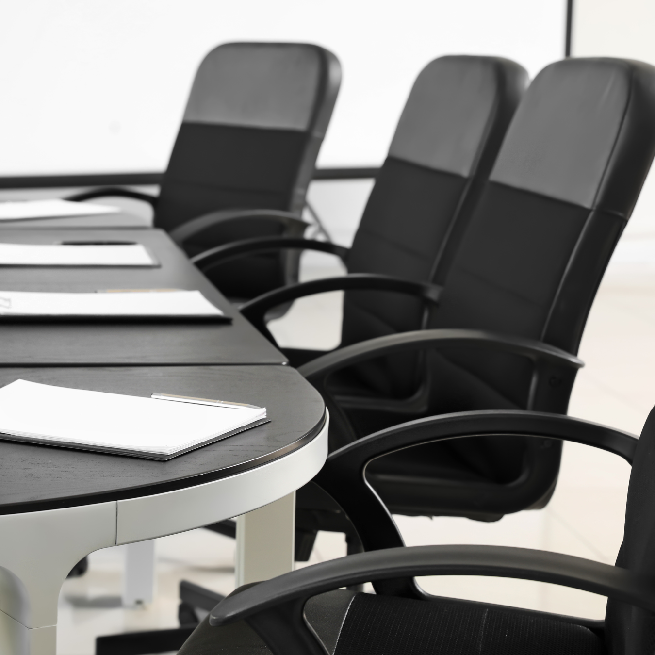 Corporate meeting room with chairs and table