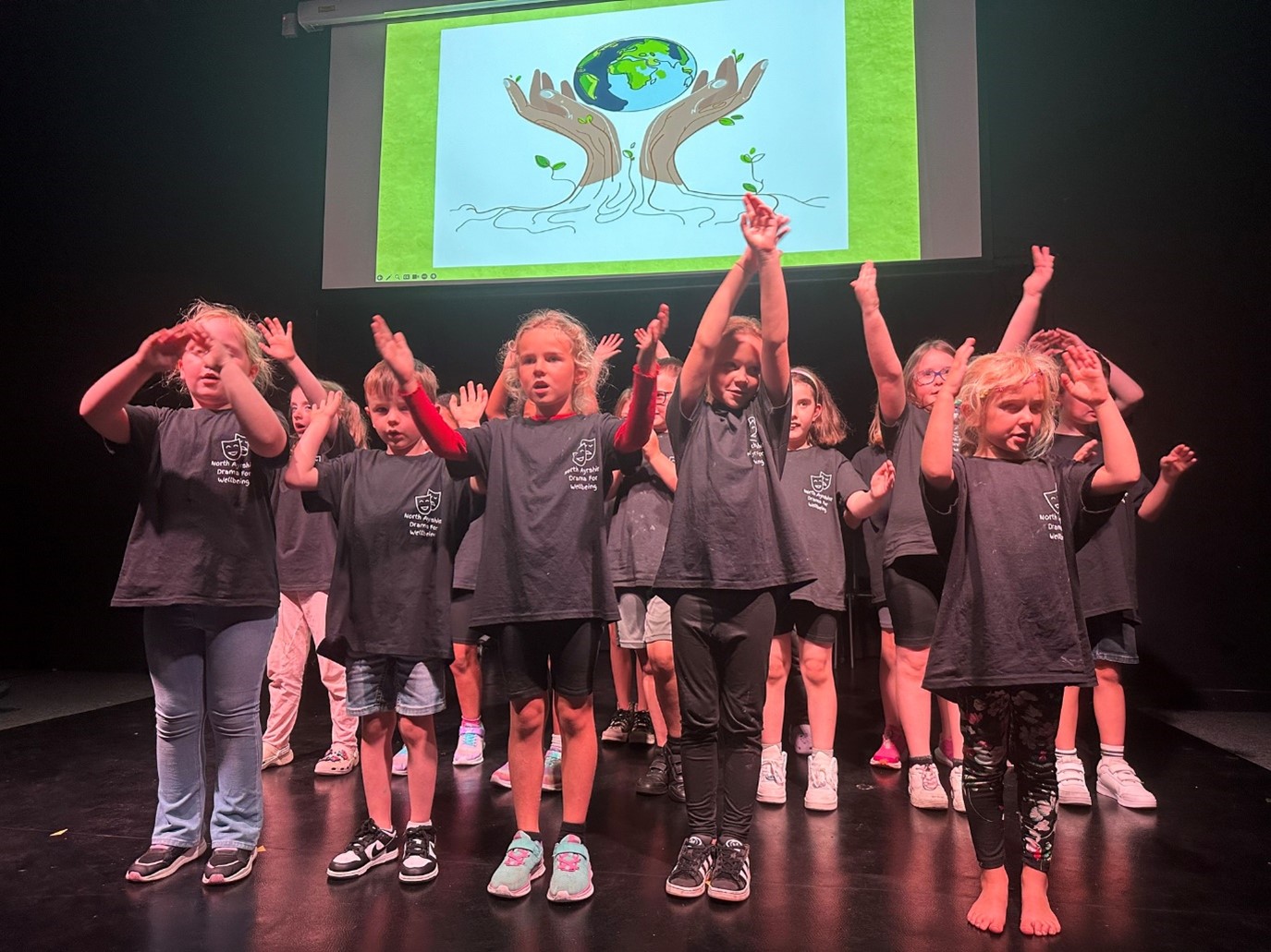 Drama for Wellbeing young performers on stage