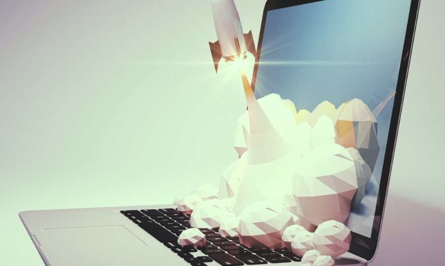 Laptop with rocket taking off from keyboard