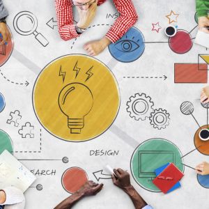 Photo collage with light bulb and people sharing ideas round a table with icons