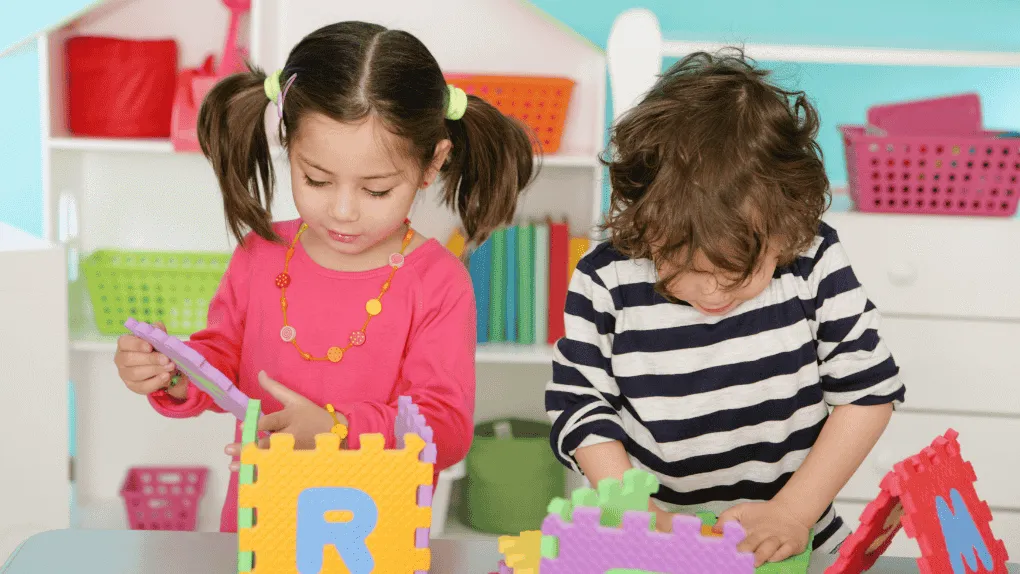 two children playing with toys in an early years setting