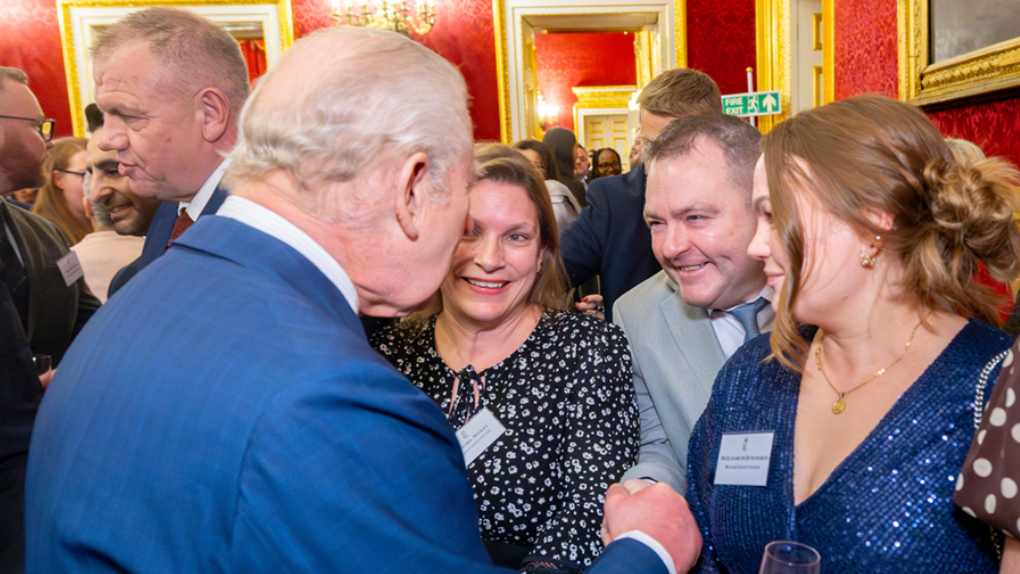 Colleague shakes hand of His Majesty the King