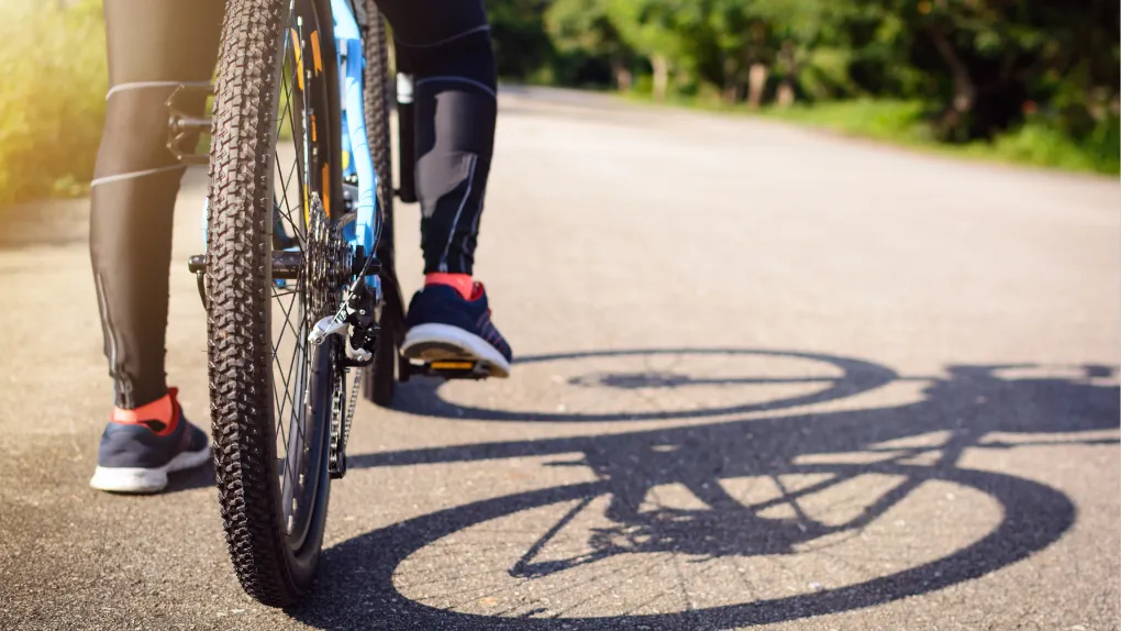 Person cycling outside
